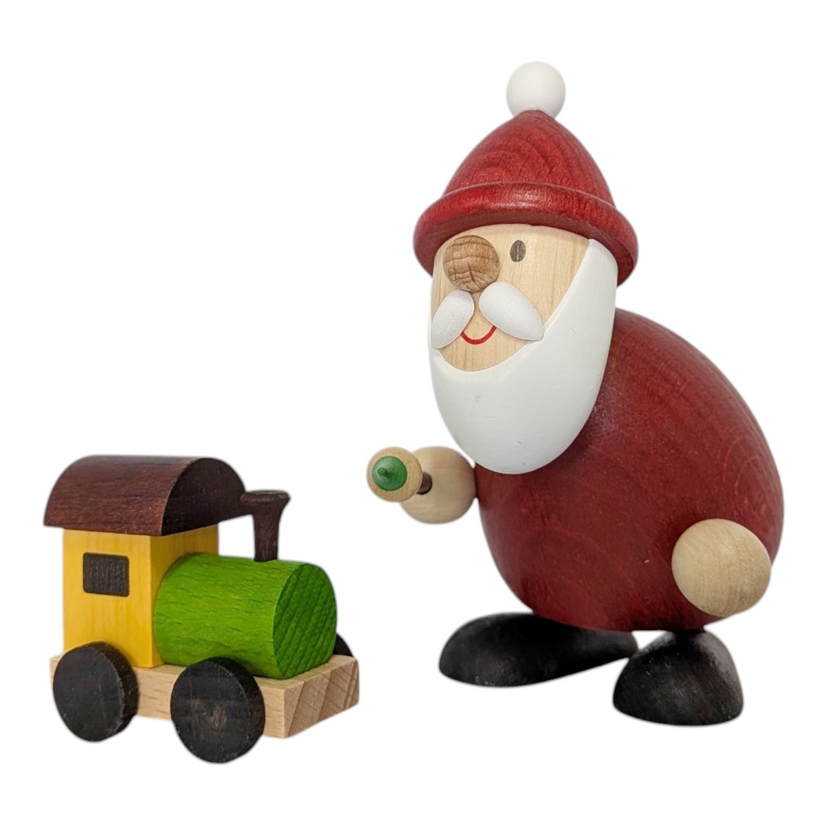 Santa Claus with a paintbrush and a toy train